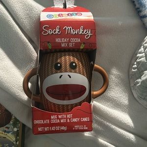 Sock monkey mug with chocolate cocoa mix and candy canes